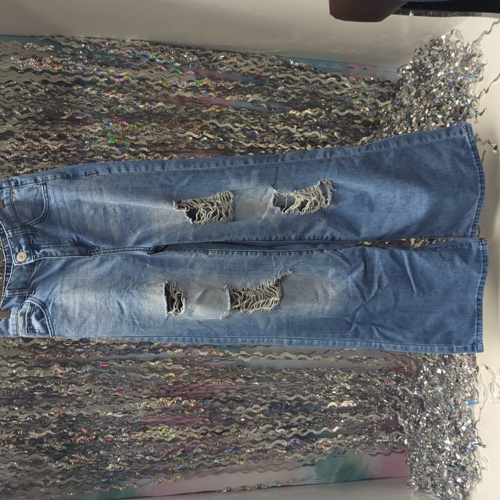 Very cute baggy, holey, ripped jeans. Made with rips in them.